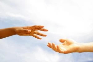 Two hands reaching out to each other